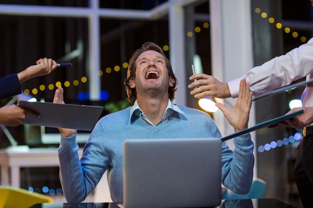 Frustrated businessman sitting in office