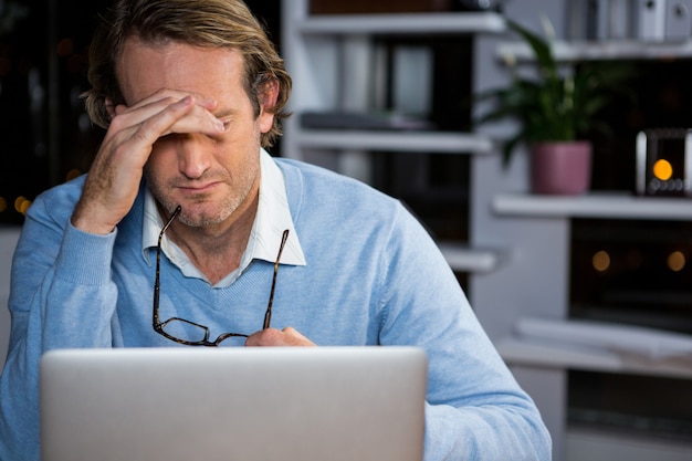 Frustrated businessman sitting in office