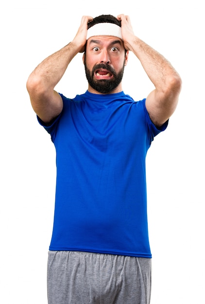 Frustrated funny sportsman on isolated white background