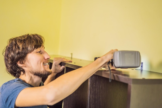 Frustrated Man Putting Together Self Assembly Furniture