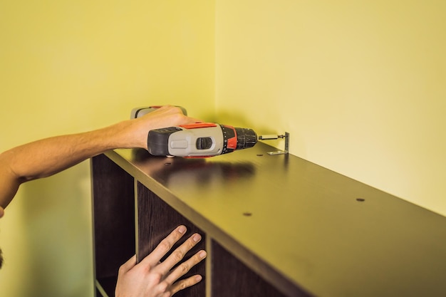 Frustrated Man Putting Together Self Assembly Furniture