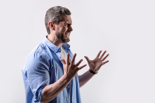 Frustrated man with frustration isolated on grey background with copy space