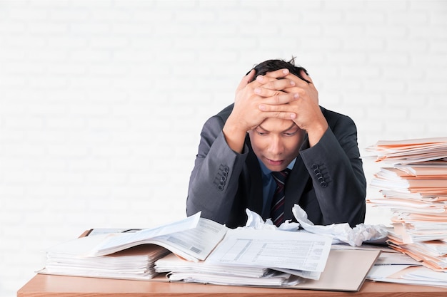 Frustrated office manager overloaded with work.