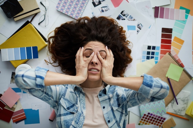 Frustrated Woman in Creative Mess