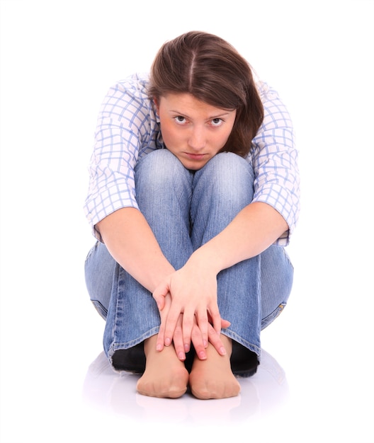 a frustrated woman sitting over white