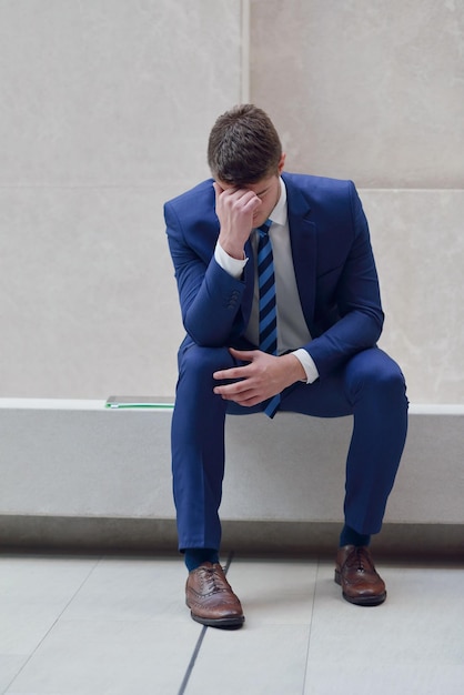 frustrated young business man working on laptop computer at office