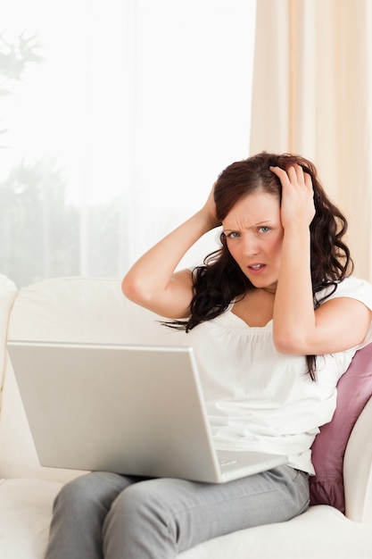 Frustrated young woman looking into the camera