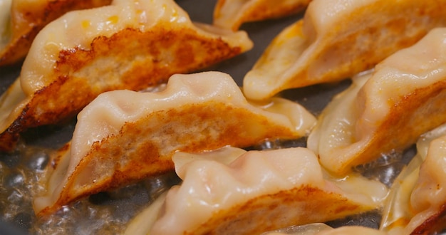 Fry meat dumpling on pan