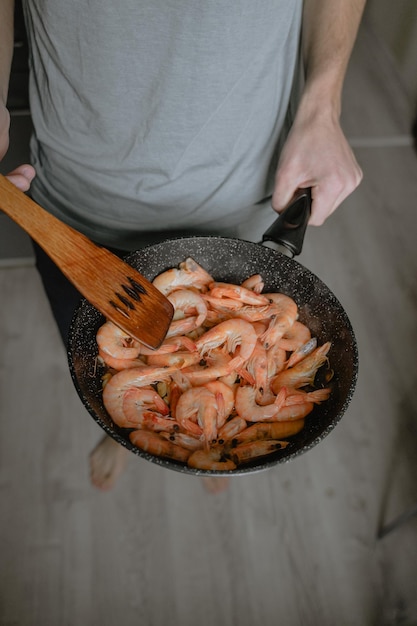 Fry seafood in a pan