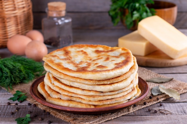 Frying flatbread filled with cheese. Khychiny or qutab - traditional caucasian or Azerbaijani flatbread