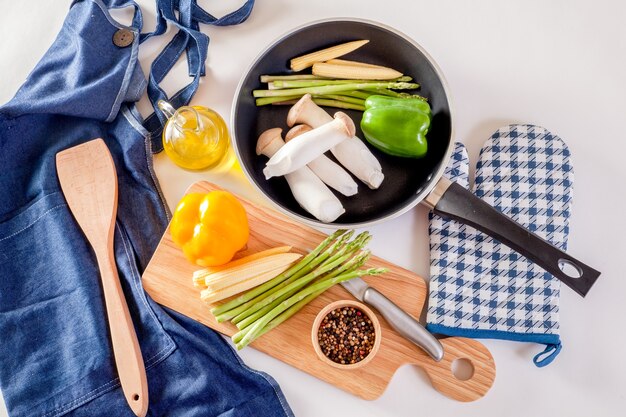 Frying pan  and fresh vegetables with cooking