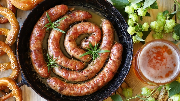 Frying pan with fried Bavarian sausages