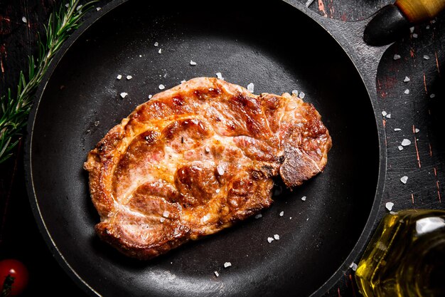 Photo frying pan with grilled steak