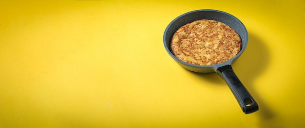 Frying pan with omelet for breakfast