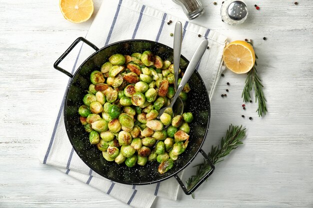 Frying pan with roasted brussel sprouts on table