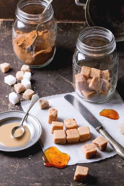 Photo fudge candy on tablecloth and caramel sause