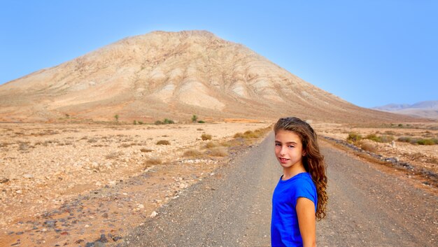 Fuerteventura girl in Tindaya mountain at Canary