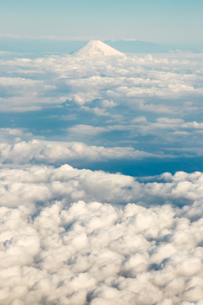 Fuji mountain in Japan with the group of cloud in the aerial view background