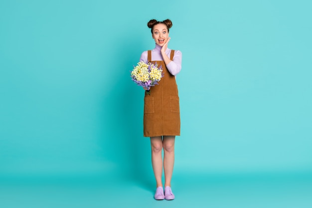 Full body photo of attractive pretty cute cheerful excited two buns hairdo girlfriend lady boyfriend unexpected gift flowers b-day palm chin wear fall outfit isolated teal color background