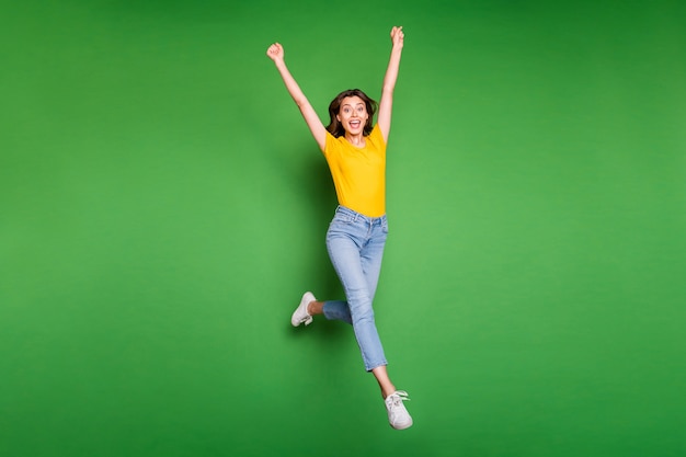 Full body photo of pretty funny l y jumping high running marathon raising hands first place winner  