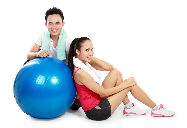 full body portrait of sporty couple with pilates ball isolated on 