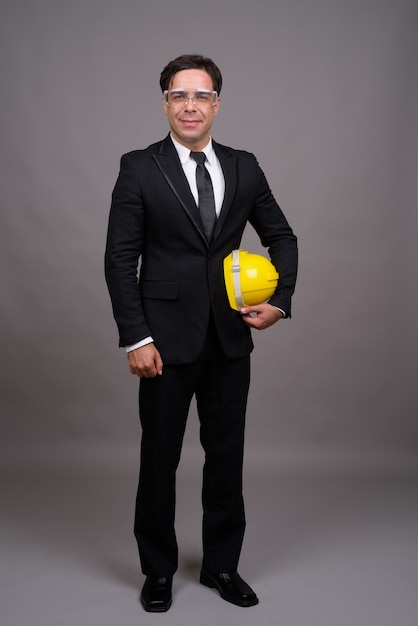 Full body shot of handsome businessman as engineer