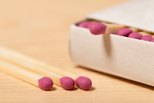 Full box of matches on the wooden table