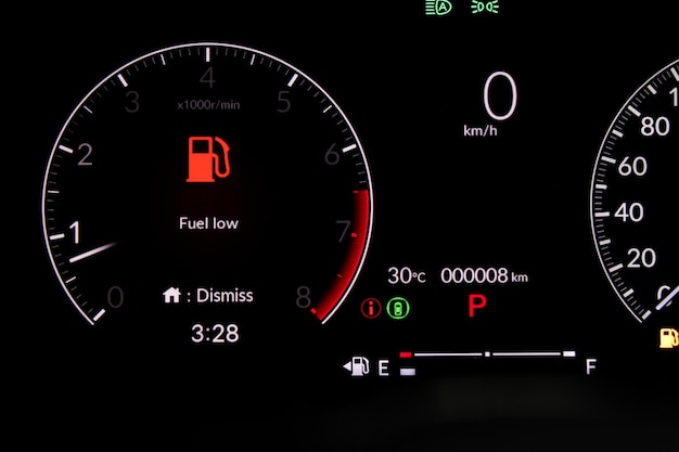 Full digital car miles or speed of meter with oli low fuel\
level warning light icon symbol on dashboard. transportation\
concept.