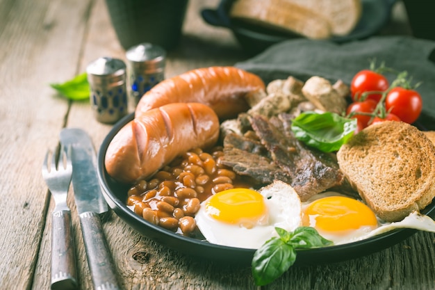 Full English breakfast on a wooden table