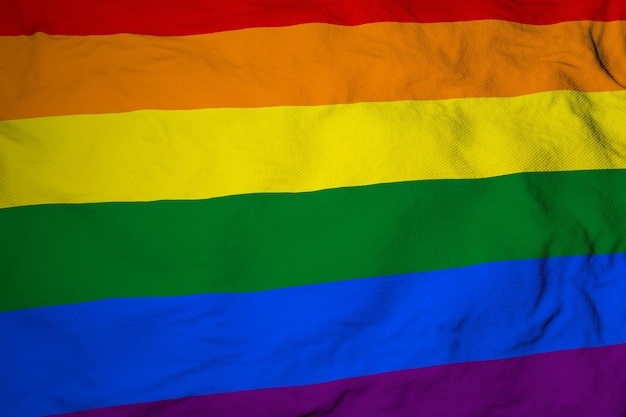 Full frame closeup on a waving Pride flag in 3D rendering