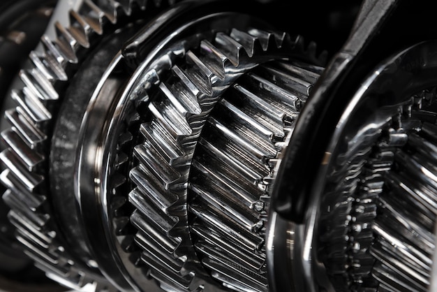 Photo full frame industrial background gear metal wheels in closeup selective focus