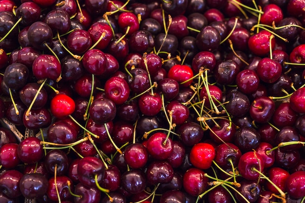 Photo full frame of red fresh cherries