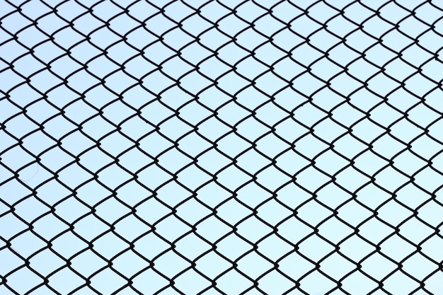 Photo full frame shot of chainlink fence against sky