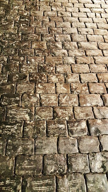 Photo full frame shot of cobblestone on red square in moscow