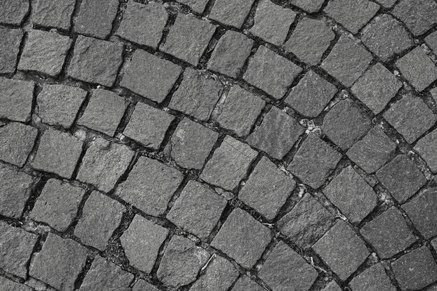 Photo full frame shot of cobblestoned footpath