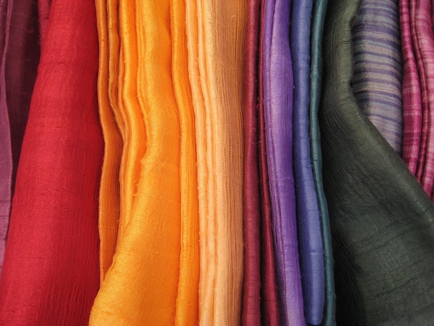 Photo full frame shot of colorful fabrics for sale at store