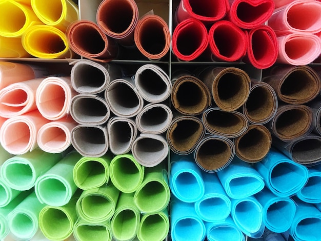 full frame shot of colorful rolled up carpets