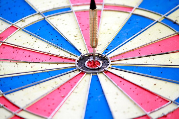 Full frame shot of dart hitting bullseye