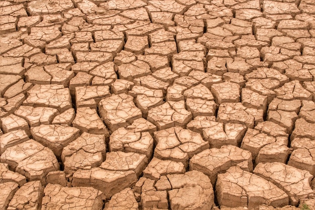 full frame shot of dried cracked field during draught