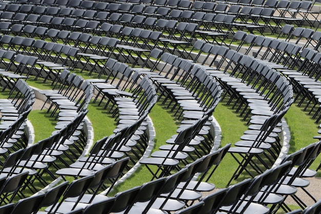 Full frame shot of empty chairs arranged on field