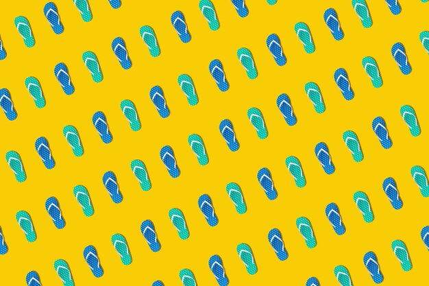 Photo full frame shot of flip-flops arranged on yellow background