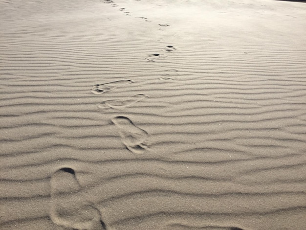 full frame shot of footprints on sand