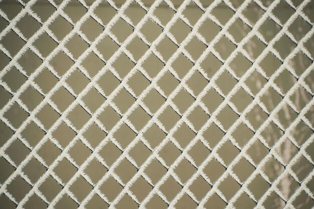 Photo full frame shot of frosted chainlink fence