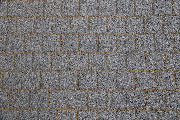 Foto immagine completa di un muro di mattoni grigi
