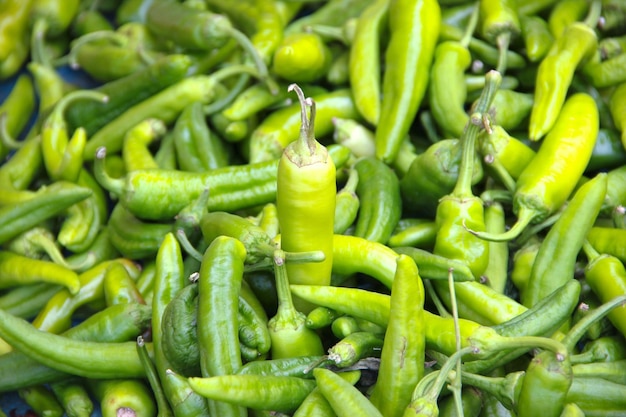 Full frame shot of green chili peppers at market stall