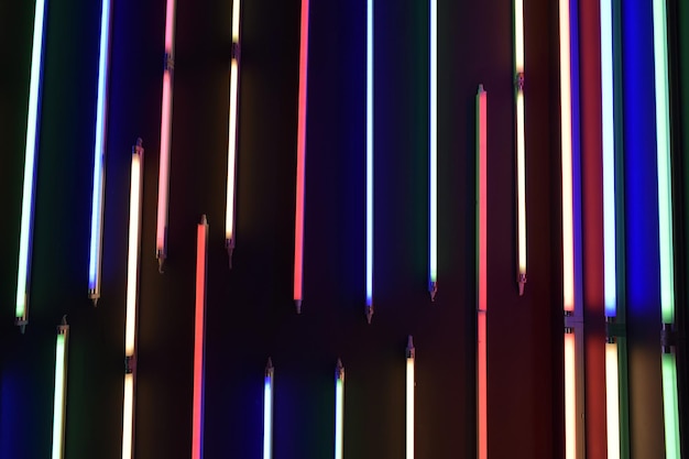full frame shot of illuminated fluorescent lights on wall