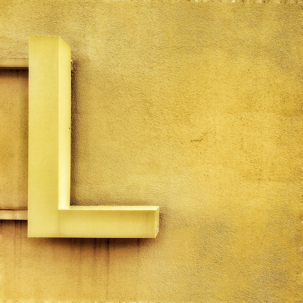 Photo full frame shot of the letter l shape attached to wall