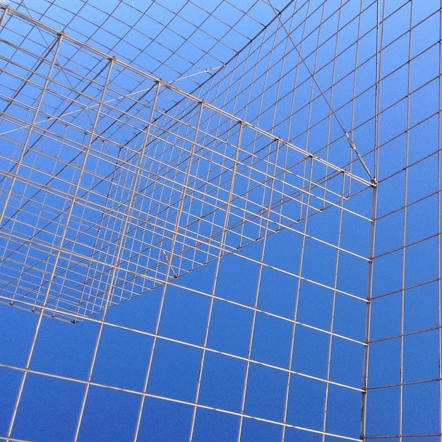 Full frame shot of modern building against blue sky