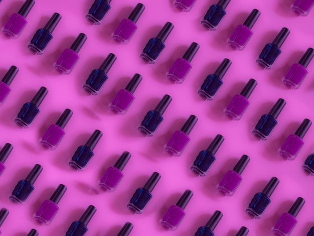 Full frame shot of nail polishes on colored background