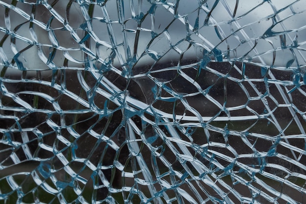 Фото Полный кадр синего разбитого стеклянного окна